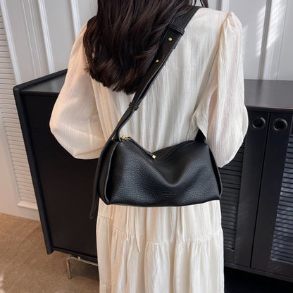 Black pillow shoulder bag worn crossbody