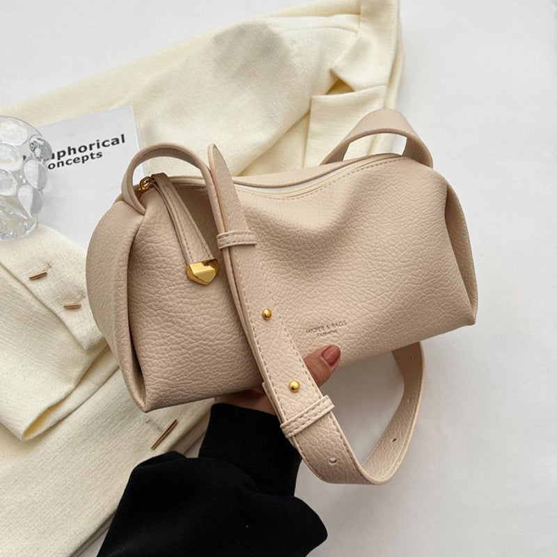 Off-white pillow shoulder bag showing zipper and strap details