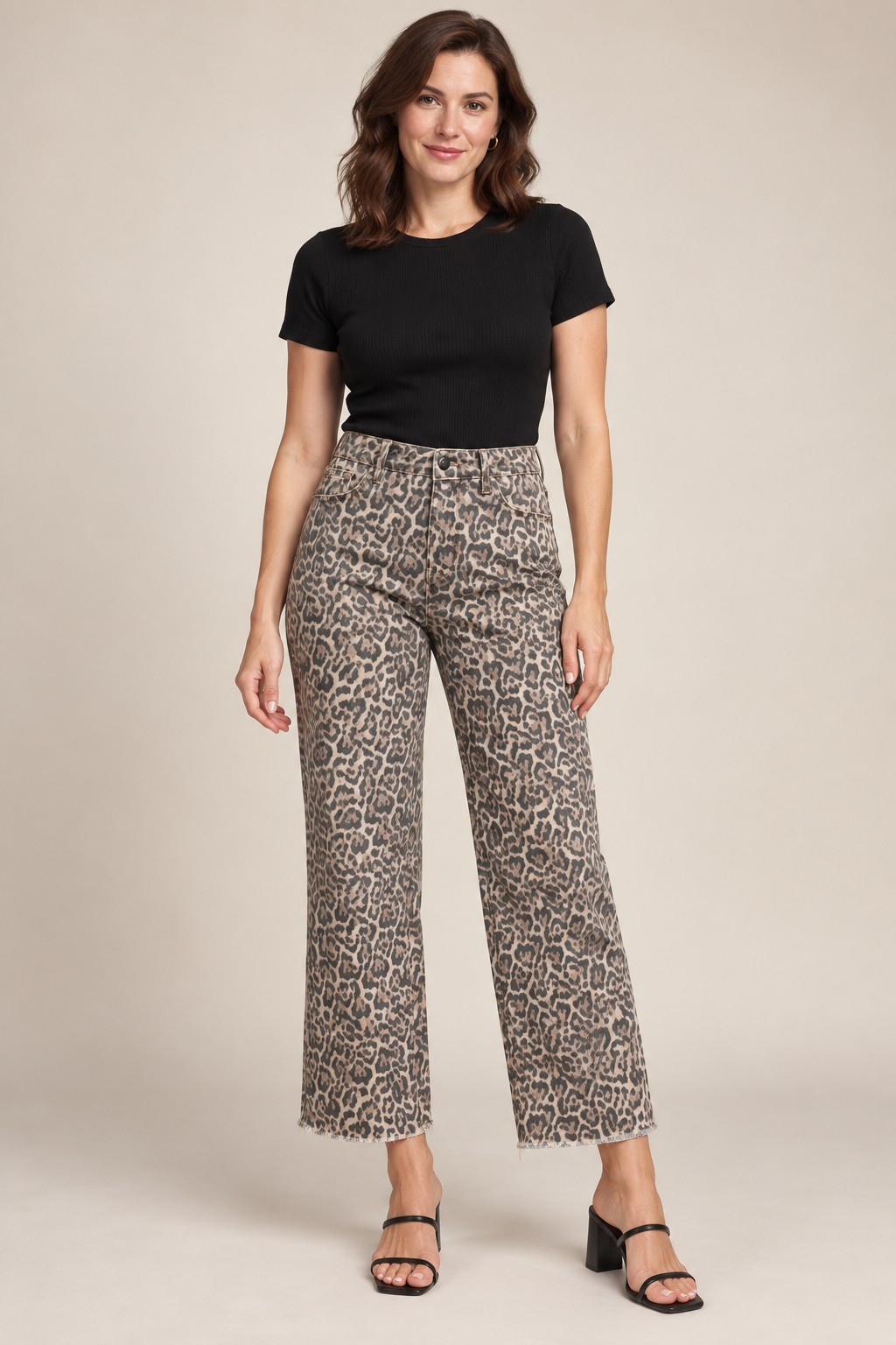 Woman wearing Brown leopard frayed-hem wide-leg jeans in a studio.