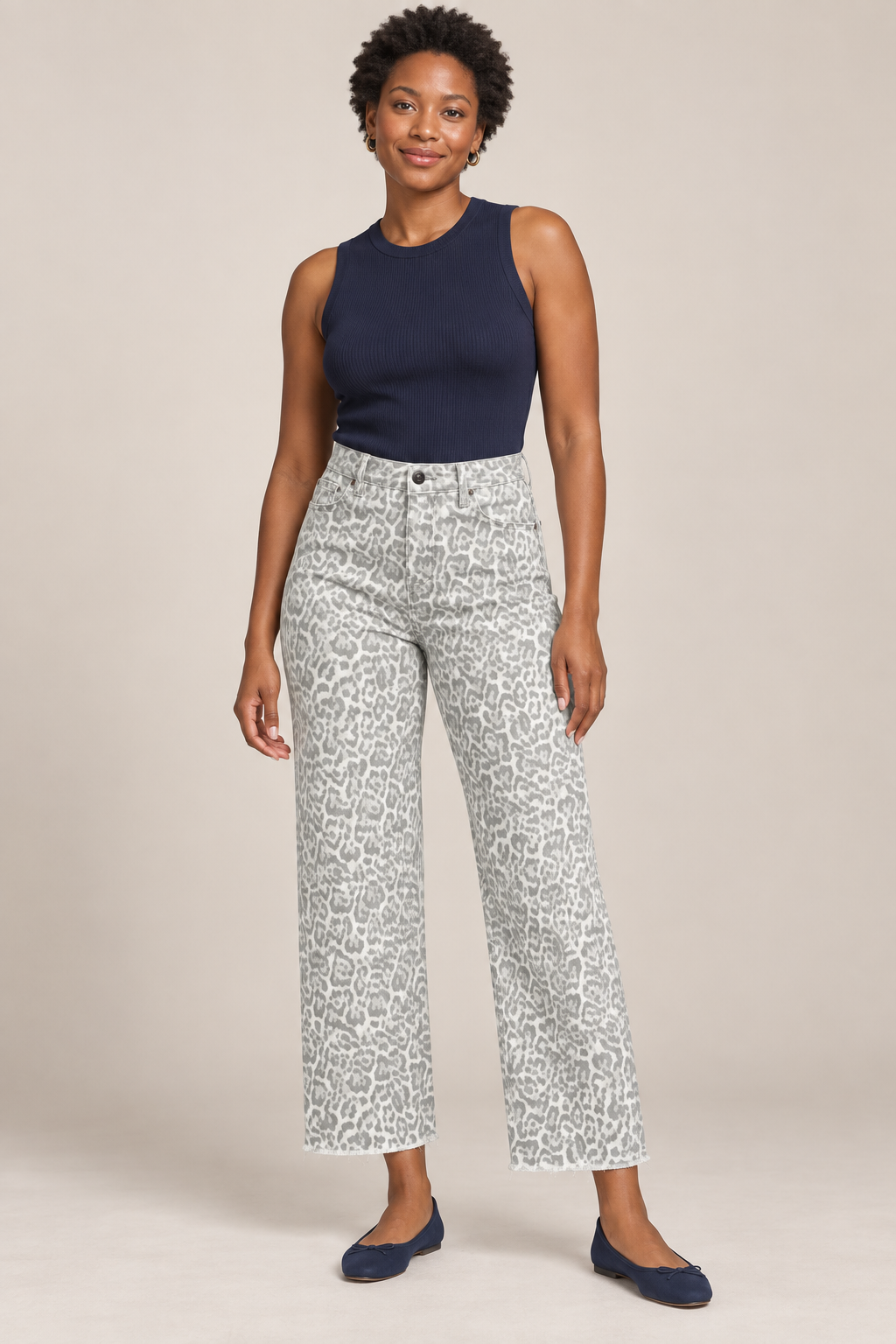 Woman wearing Gray frayed-hem wide-leg jeans in a studio.