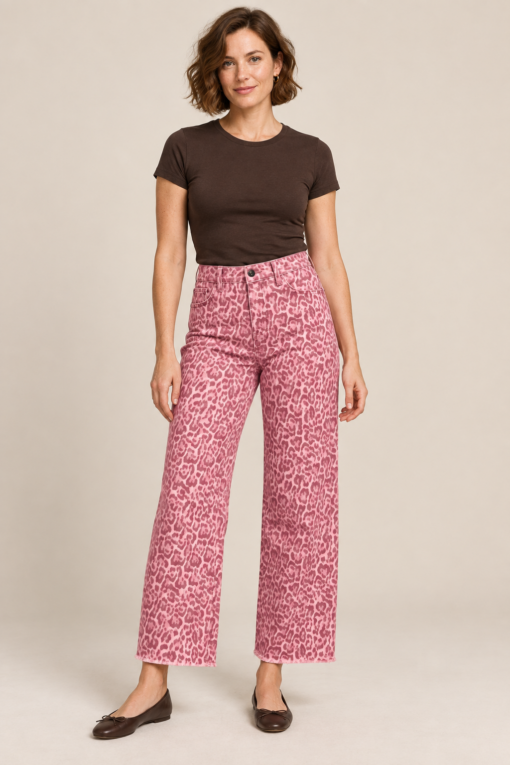 Woman wearing Rose frayed-hem wide-leg jeans in a studio.