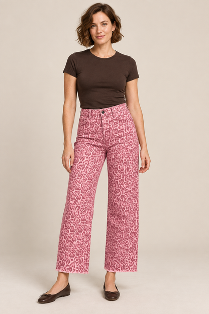Woman wearing Rose frayed-hem wide-leg jeans in a studio.