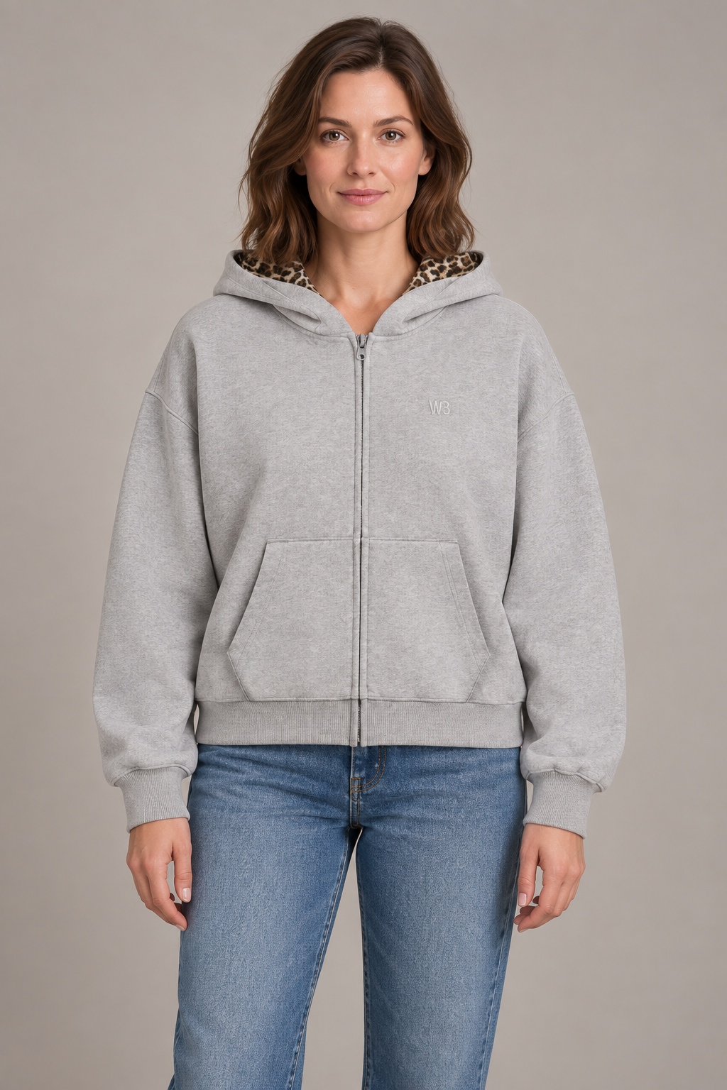 Women's floral gray zip-front hooded cardigan jacket with chest emblem, studio front view.