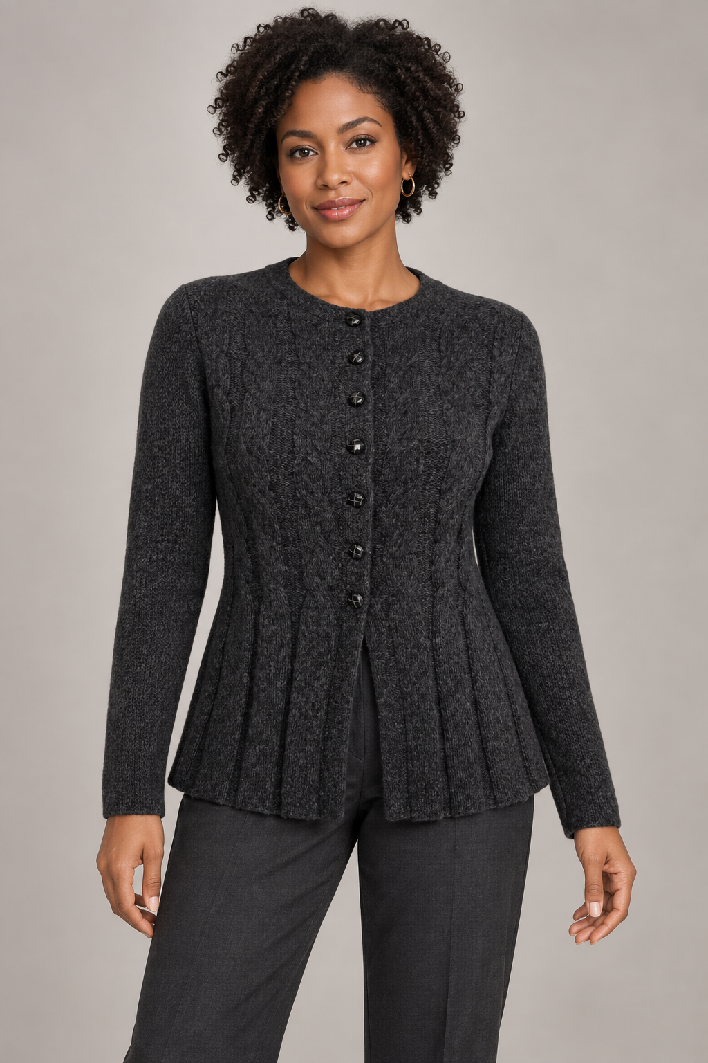 Women's black knit cardigan studio view