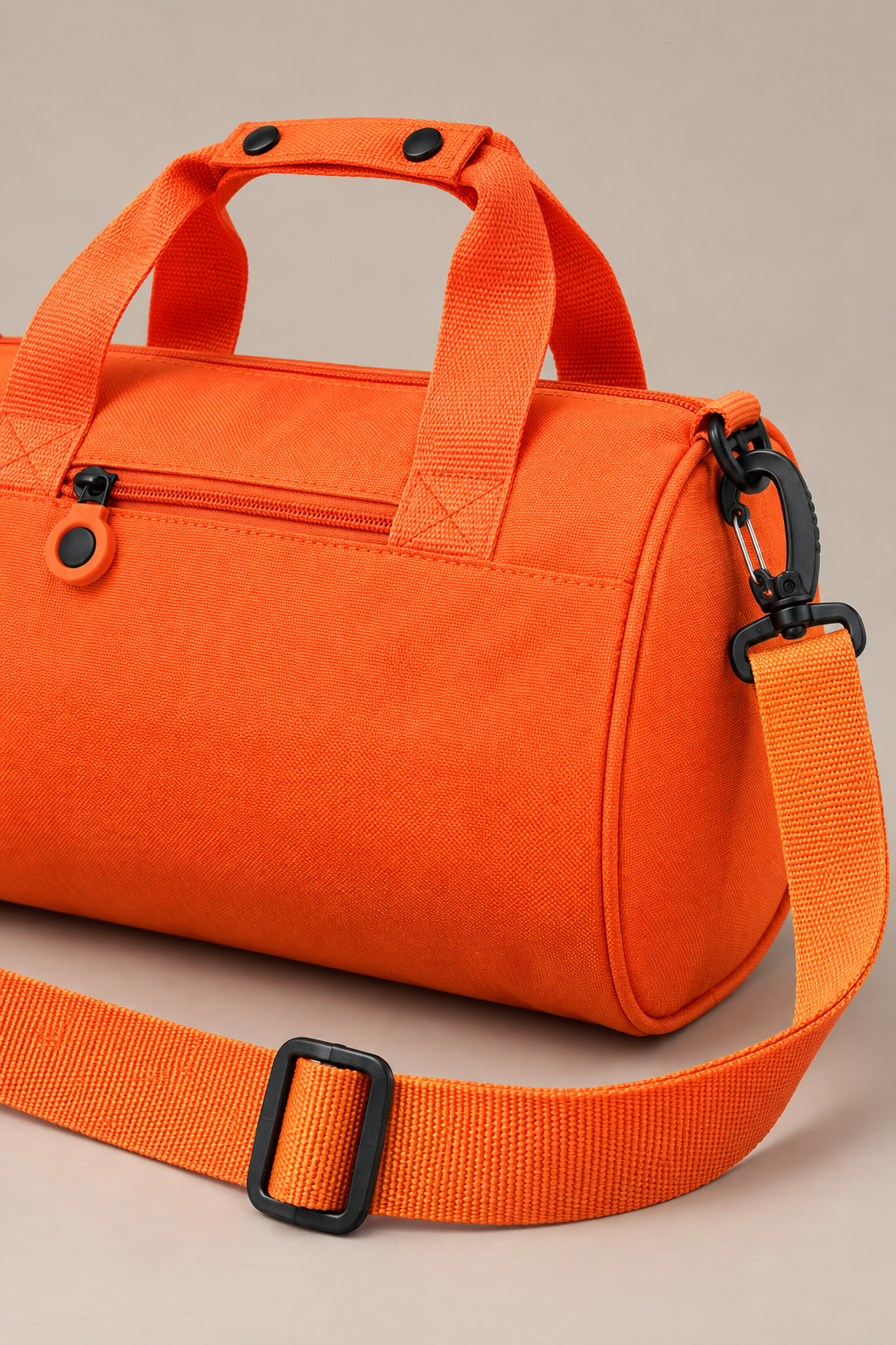 Handles and detachable shoulder strap on the Orange Oxford travel shoulder bag
