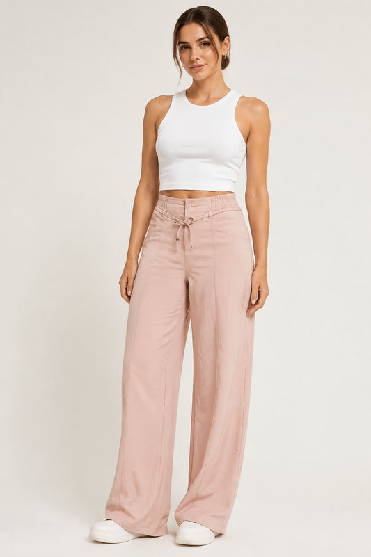 Women's light pink high-waist drawstring cargo pants studio view