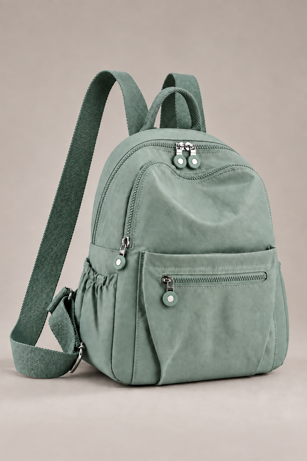 Women’s light green compact nylon travel backpack studio view