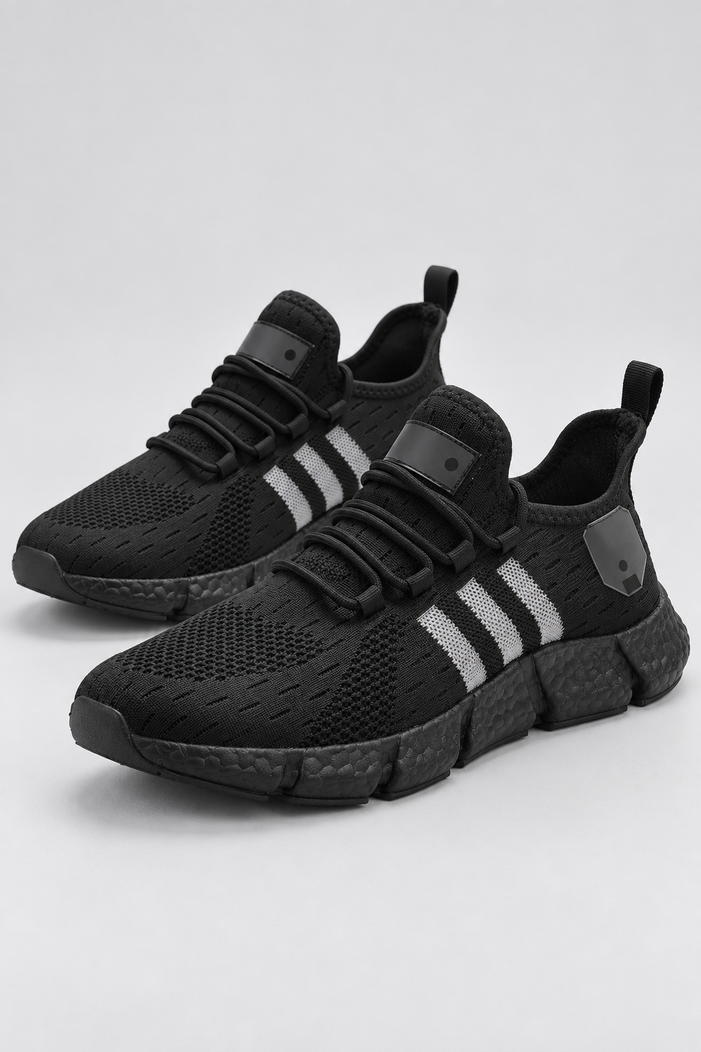 Men’s all black knit lace-up sneakers with EVA sole studio view