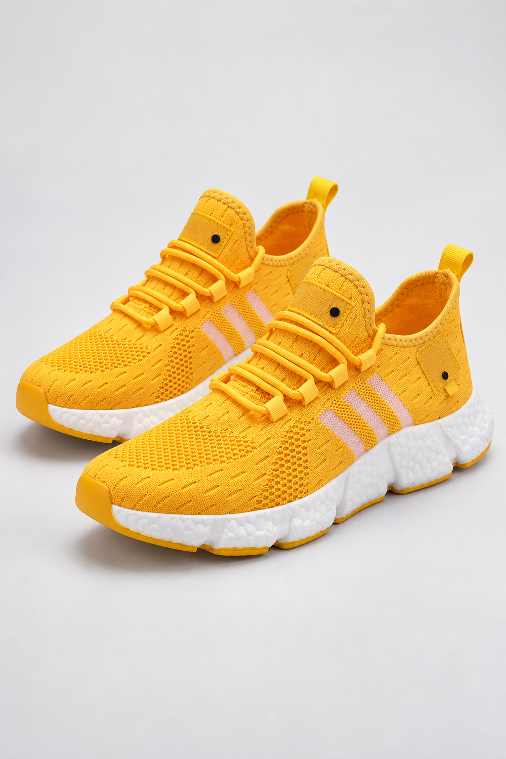Men’s yellow knit lace-up sneakers with EVA sole studio view