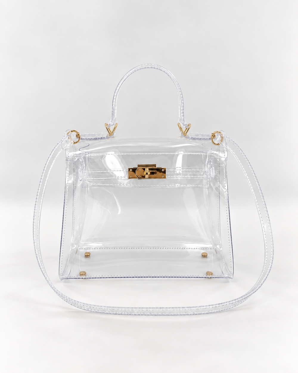 AuraX transparent PVC lock-buckle handbag with gold-tone hardware, front studio view