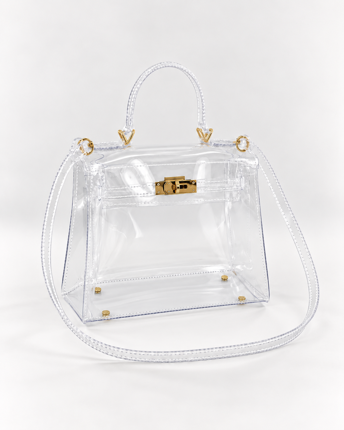 AuraX transparent PVC lock-buckle handbag with gold-tone hardware, three-quarter studio view