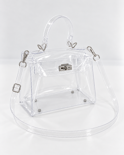 AuraX transparent PVC lock-buckle handbag with silver-tone hardware, three-quarter studio view