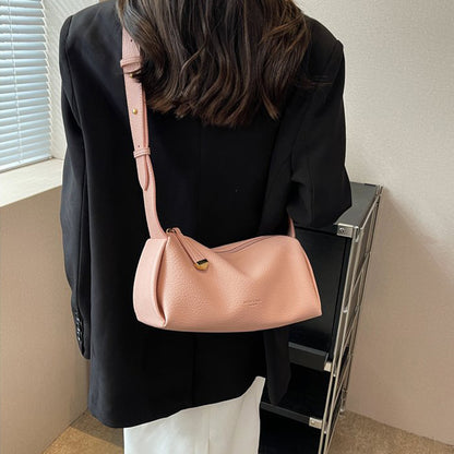 Pink pillow shoulder bag styled for shoulder carry