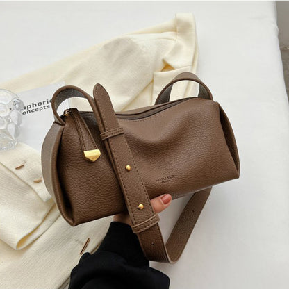 Brown pillow shoulder bag showing pebbled texture and hardware