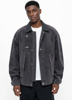 Black male model wearing detailed grey faux-suede work jacket with airplane toggle closures