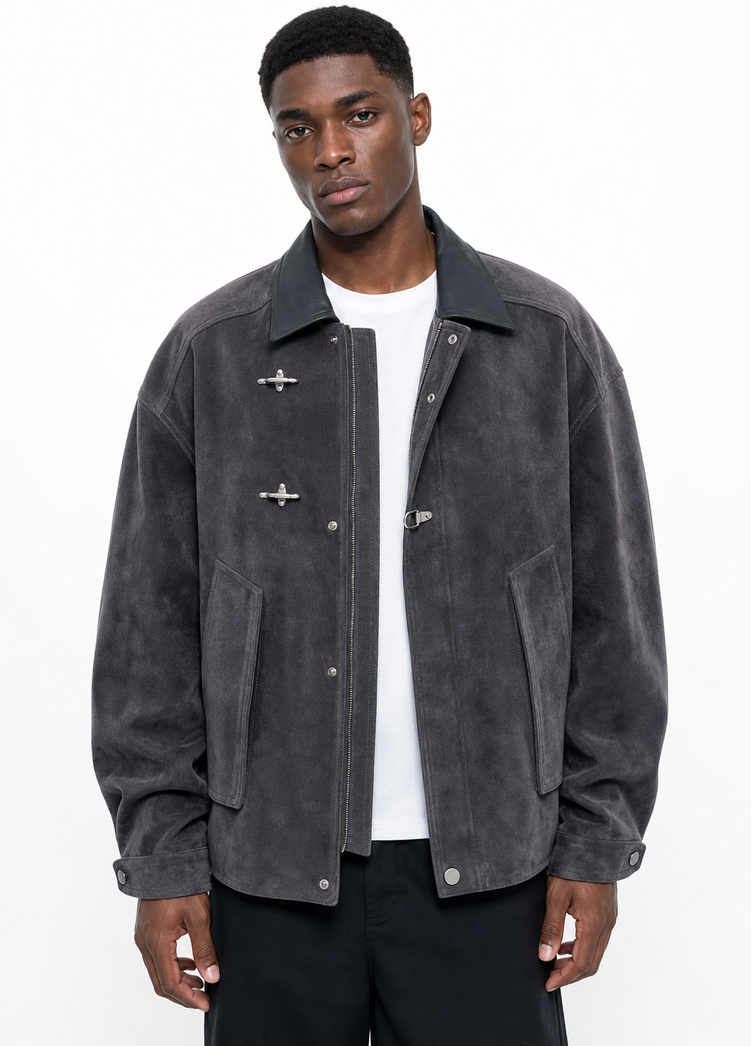 Black male model wearing detailed grey faux-suede work jacket with airplane toggle closures