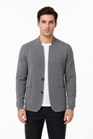 Male model wearing grey two-button knit cardigan jacket with front patch pockets