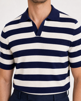 Close-up of navy and white striped short sleeve knit polo shirt collar and fabric