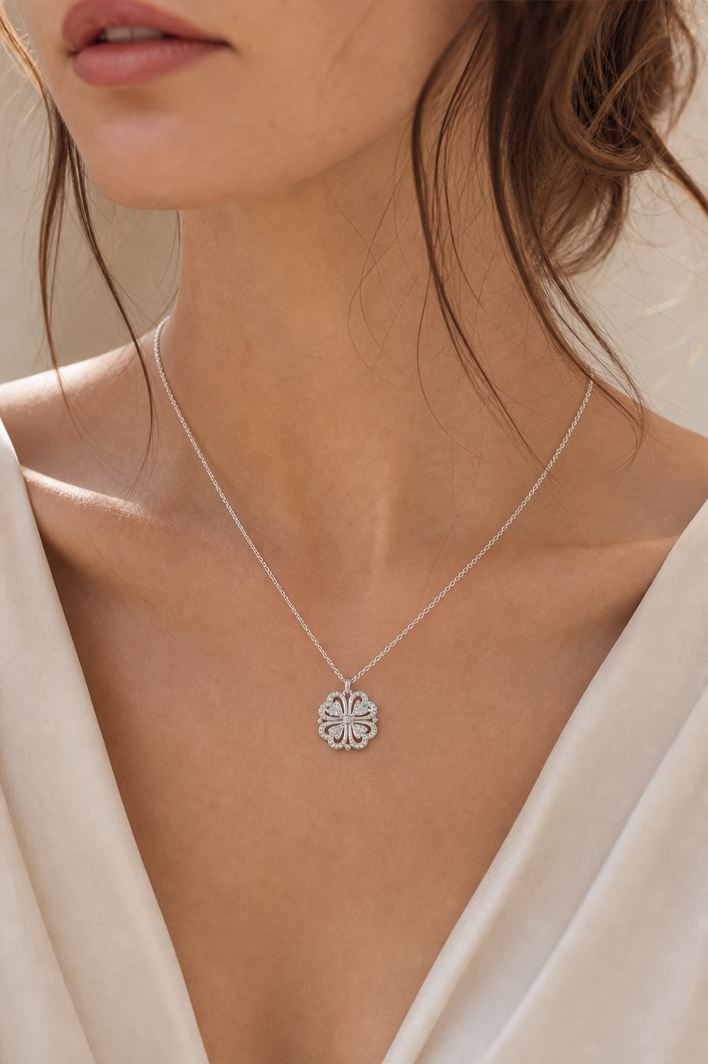 Model wearing silver heart clover pendant necklace