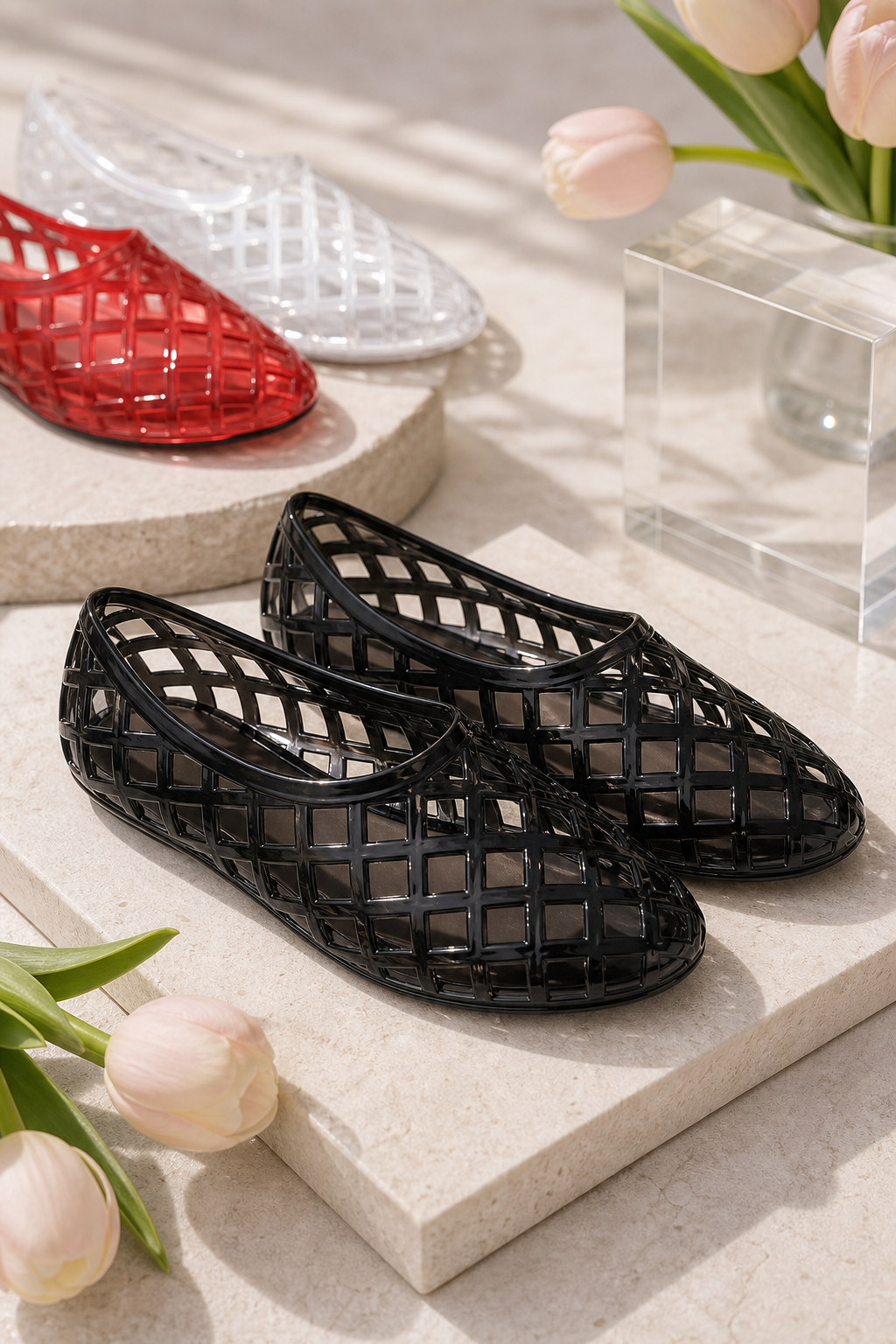 Premium product image of Women's Woven PVC Jelly Flats in a boutique setting