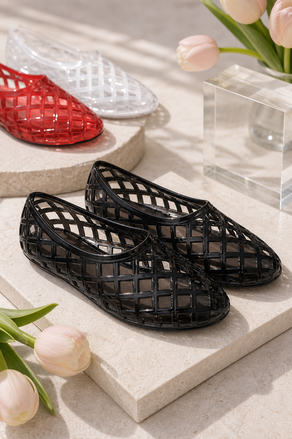 Premium product image of Women's Woven PVC Jelly Flats in a boutique setting